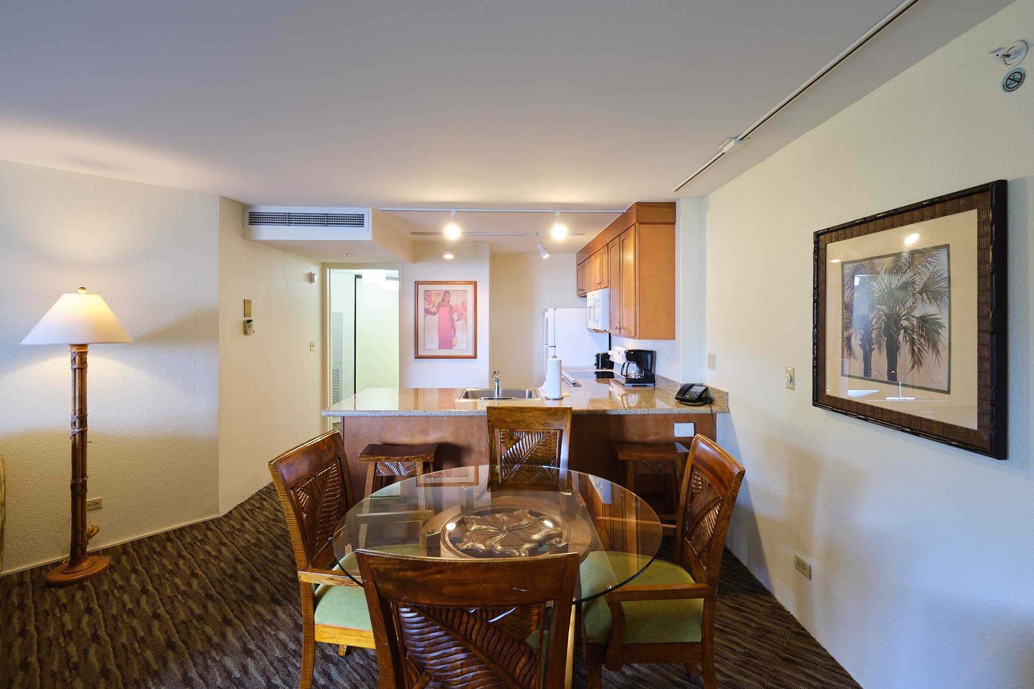 3445 Lower Honoapiilani Road, Unit 212 Lahaina, HI 96761 - Photo 26 of 39 a view of a dining room with furniture window and wooden floor