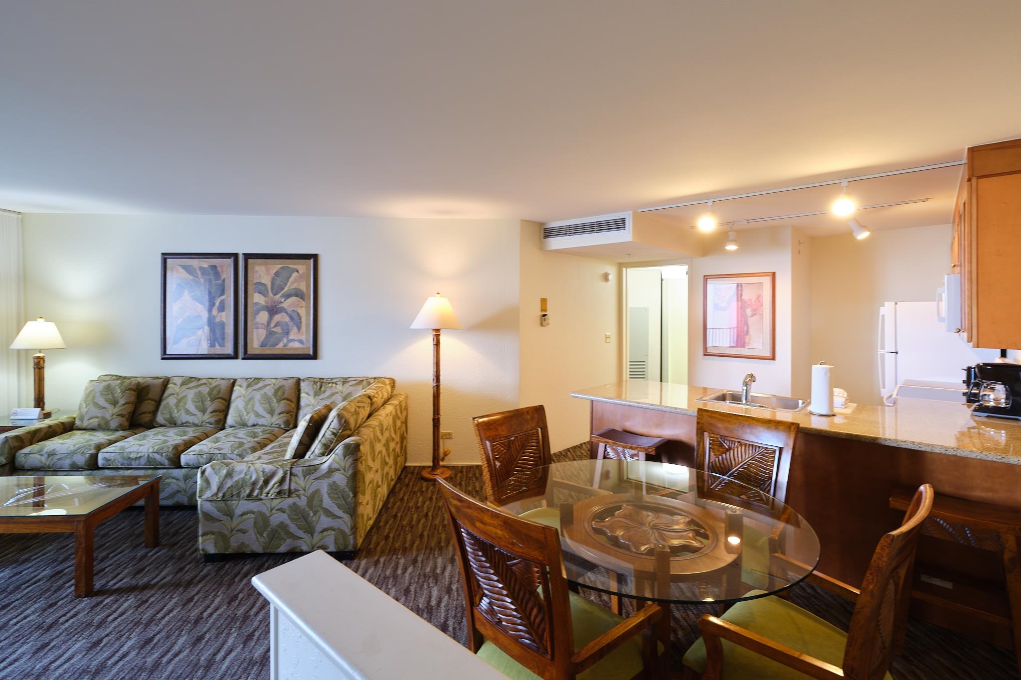 3445 Lower Honoapiilani Road, Unit 212 Lahaina, HI 96761 - Photo 27 of 39 a living room with furniture and wooden floor