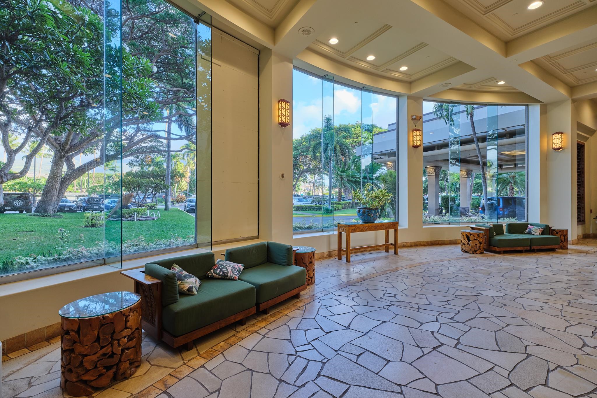 3445 Lower Honoapiilani Road, Unit 212 Lahaina, HI 96761 - Photo 37 of 39 a living room with patio area and garden view