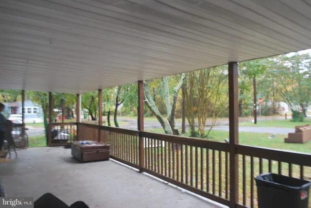 a kitchen with sink cabinets and wooden floor
