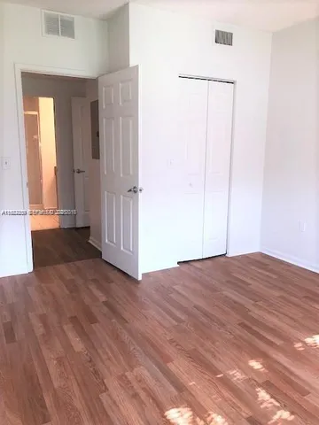 a view of a bathroom from a hallway