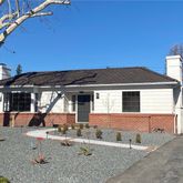 a backyard of a house with yard fire pit and outdoor seating