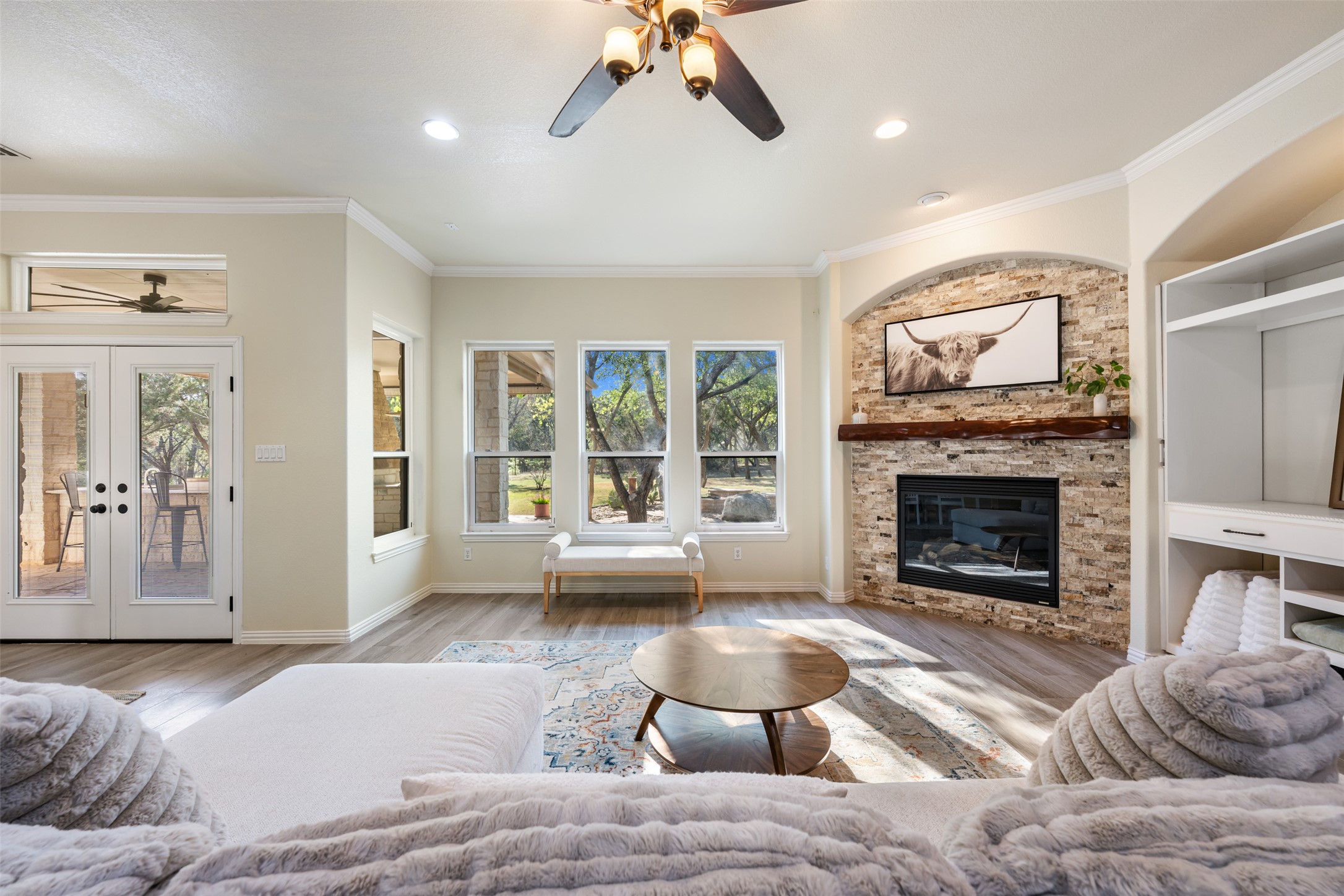 181 Whitney Run Buda, TX 78610 - Photo 11 of 40 Living room features views of the park-like backyard & outdoor entertaining space.