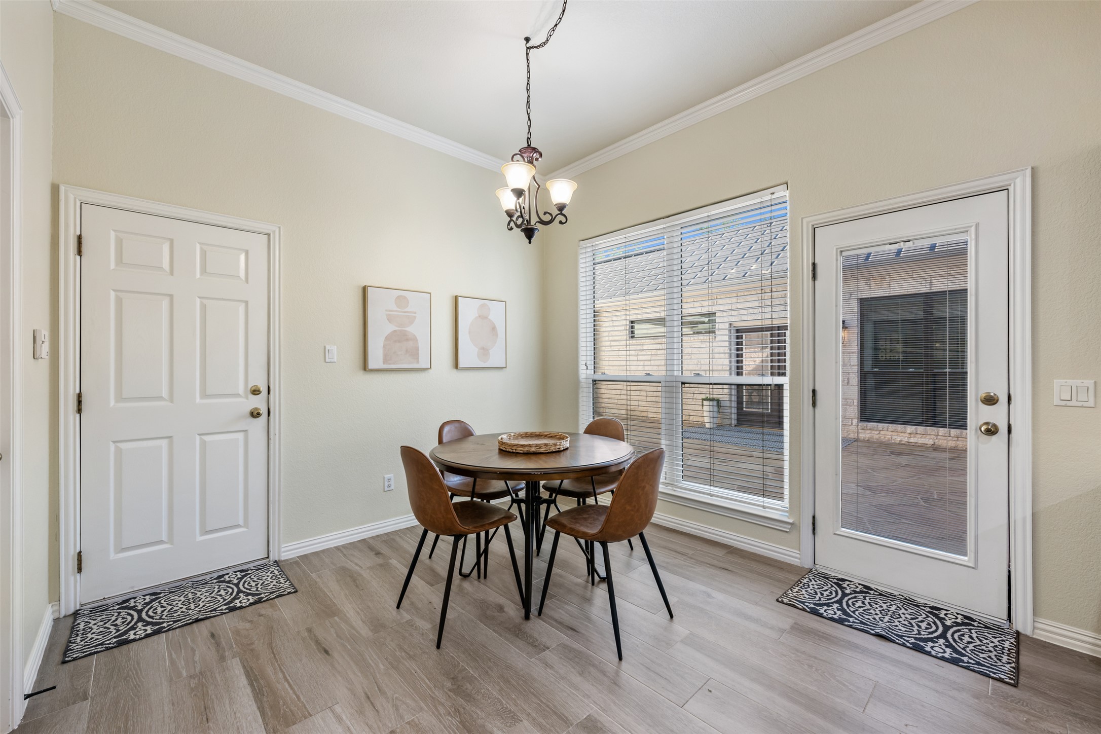 181 Whitney Run Buda, TX 78610 - Photo 17 of 40 Very spacious breakfast room with view of the central courtyard. Door beyond goes to 3-car garage. Large utility room also off breakfast room.