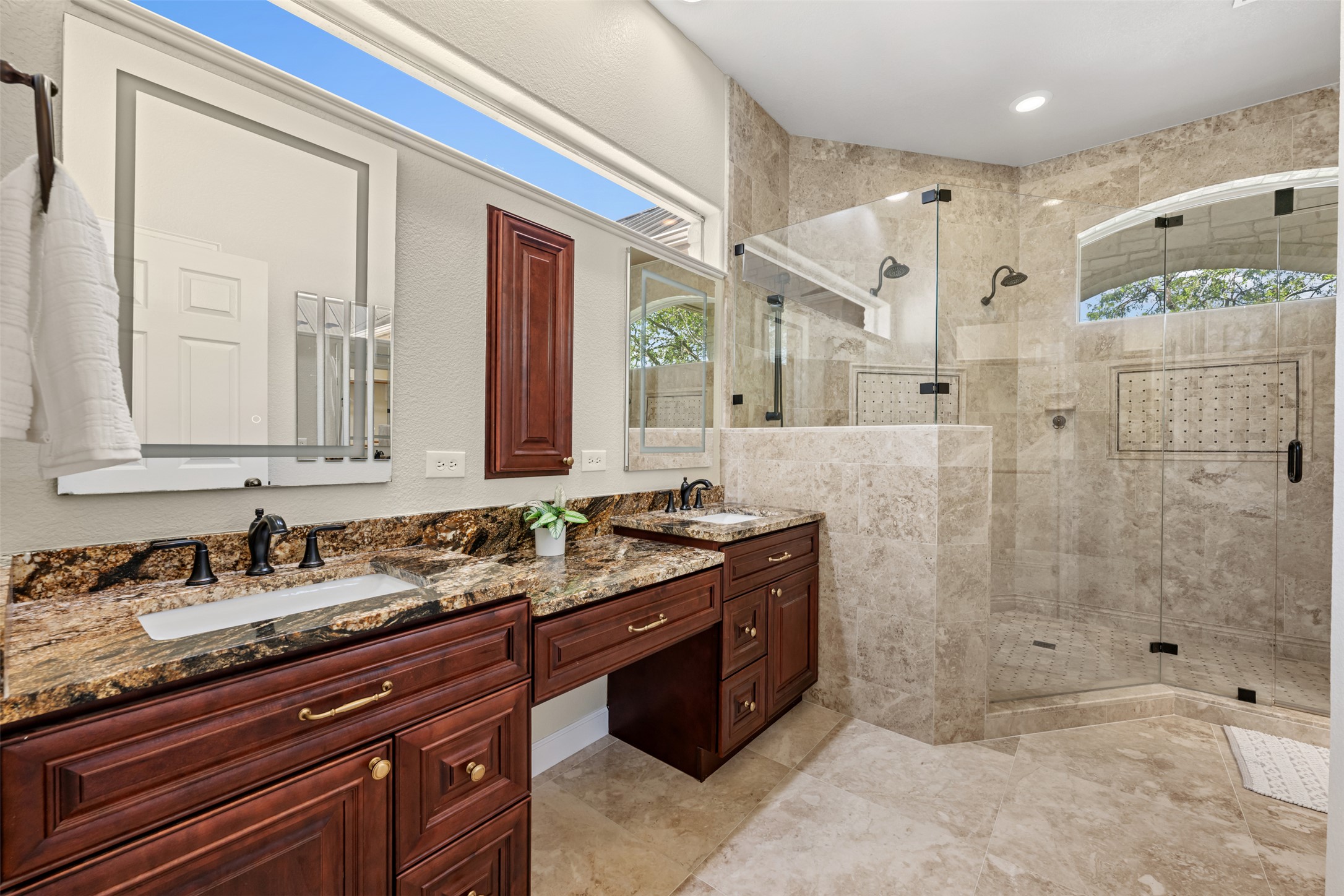181 Whitney Run Buda, TX 78610 - Photo 22 of 40 Spa-like primary bathroom with amazing walk-in shower, dual vanity sinks, granite countertops & large walk-in closet.
