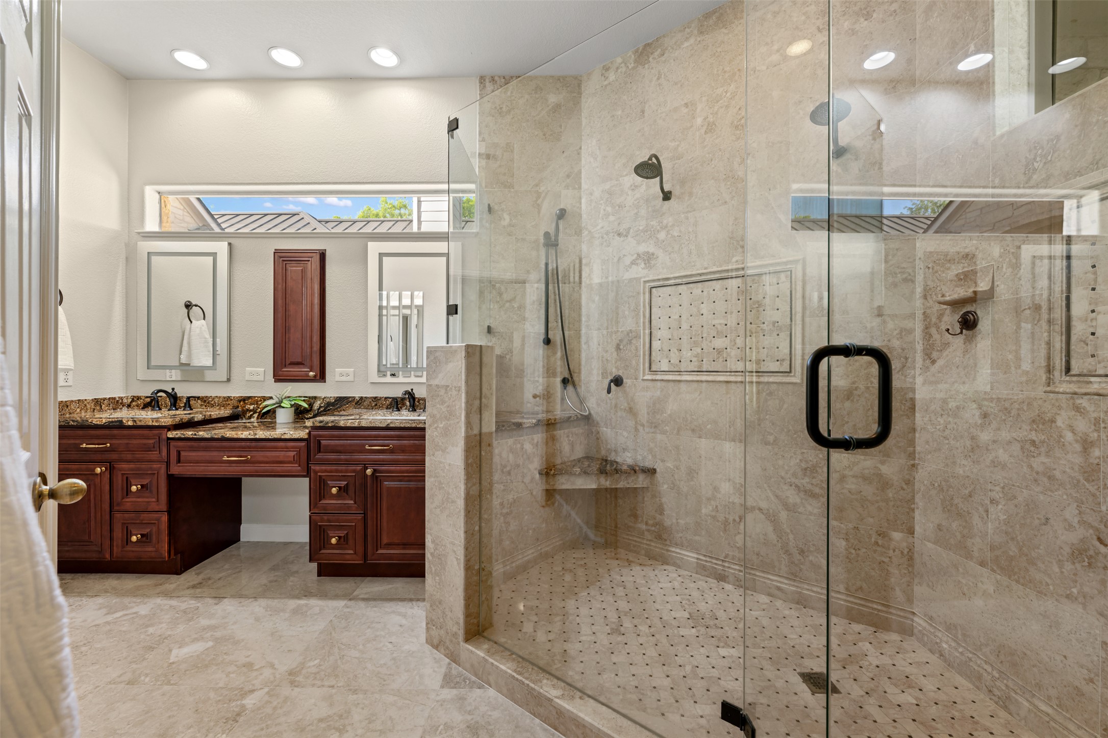 181 Whitney Run Buda, TX 78610 - Photo 23 of 40 Spa-like primary bathroom with amazing walk-in shower, dual vanity sinks, granite countertops & large walk-in closet.