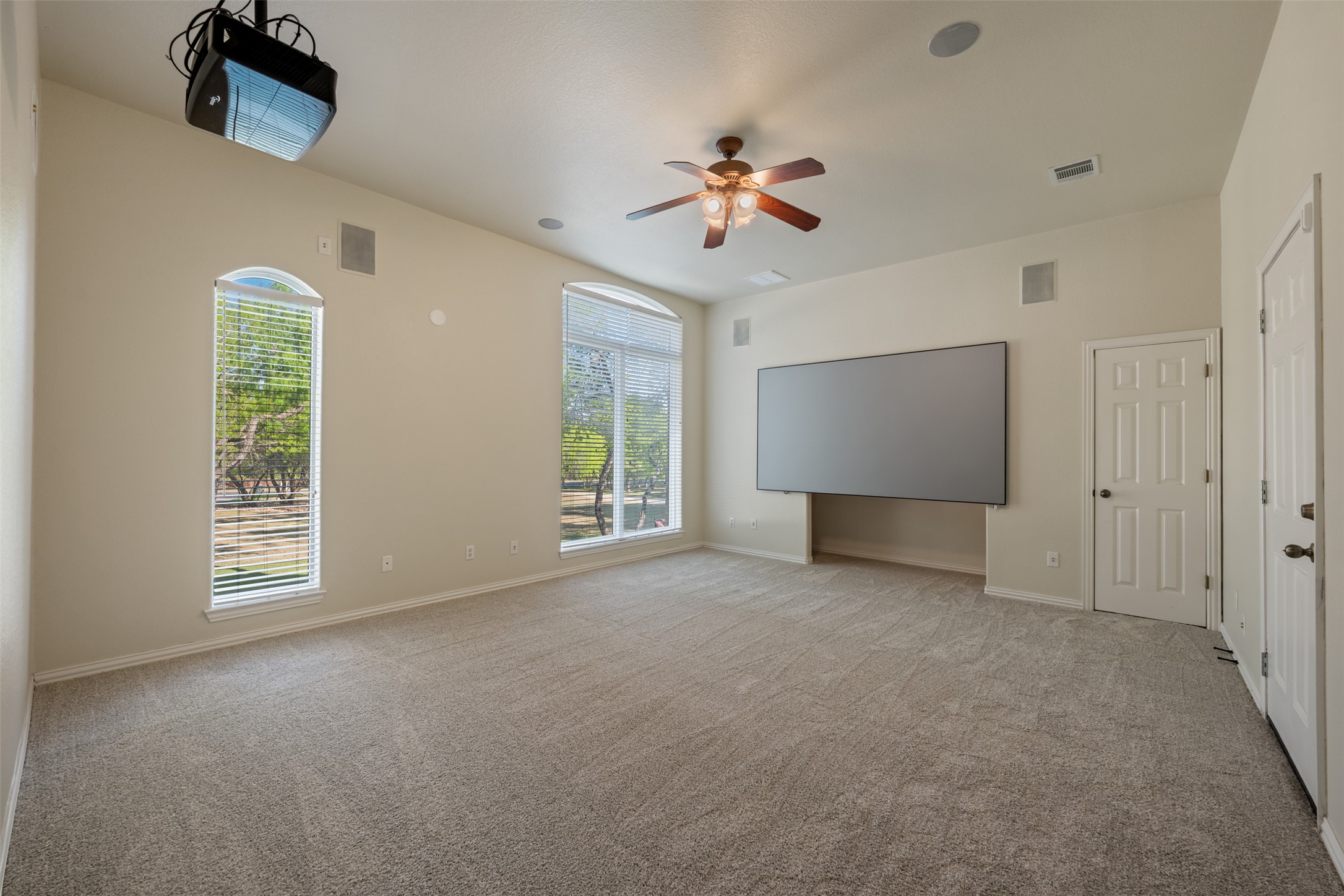 181 Whitney Run Buda, TX 78610 - Photo 29 of 40 4th bedroom has a private entry from the garage and courtyard. Currently being utilized by owners as a media room. Potential for MIL suite, gameroom, studio, etc!