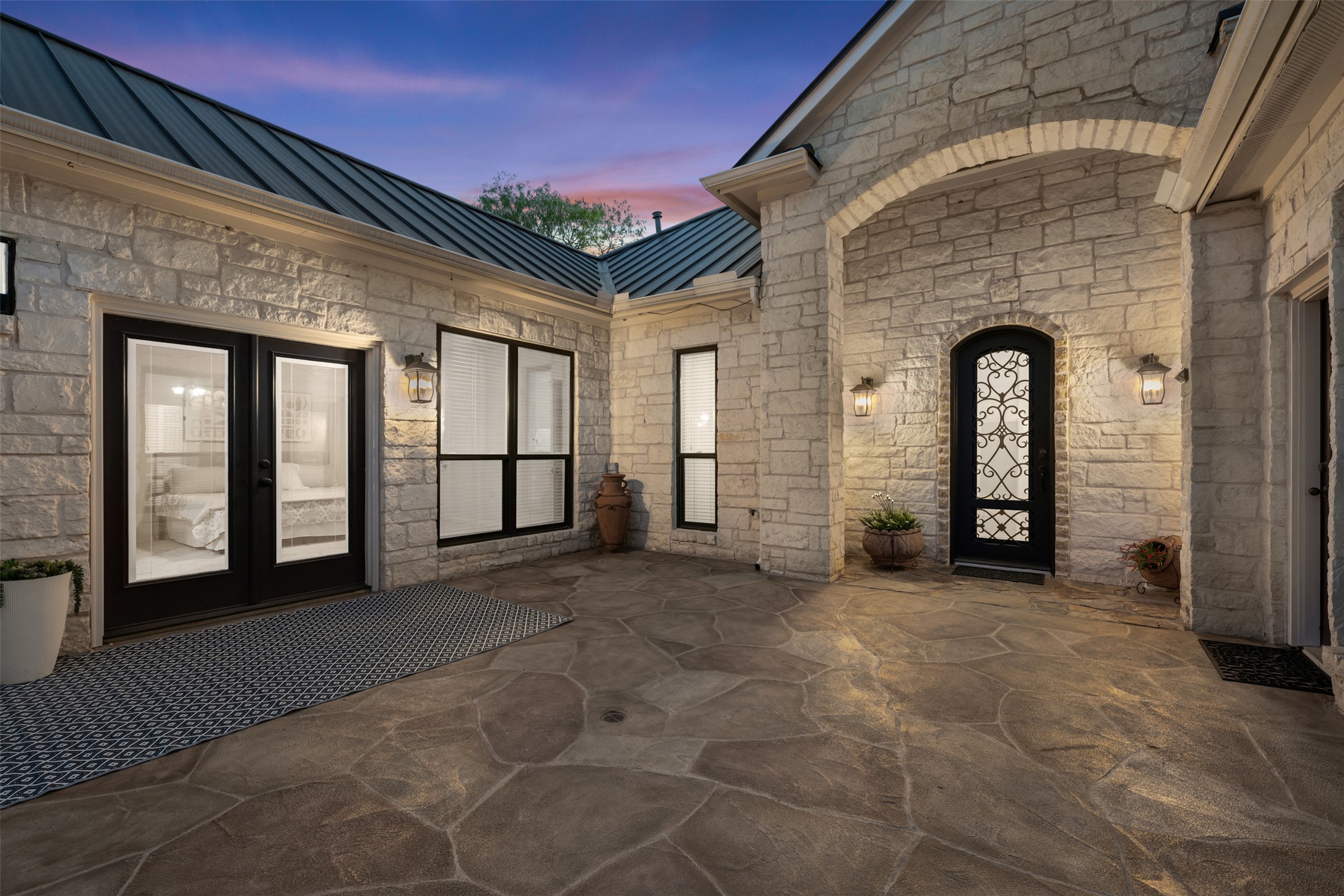 181 Whitney Run Buda, TX 78610 - Photo 31 of 40 Beautiful interior courtyard at night.