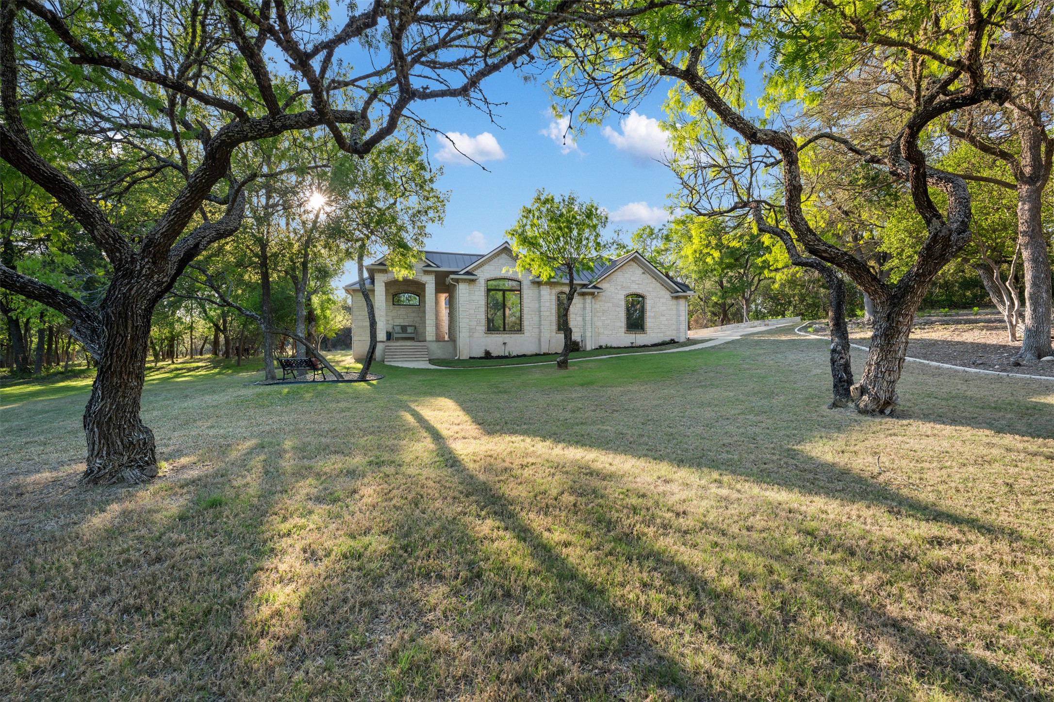 181 Whitney Run Buda, TX 78610 - Photo 3 of 40 Very private lot with mature oak trees & park-like backyard.