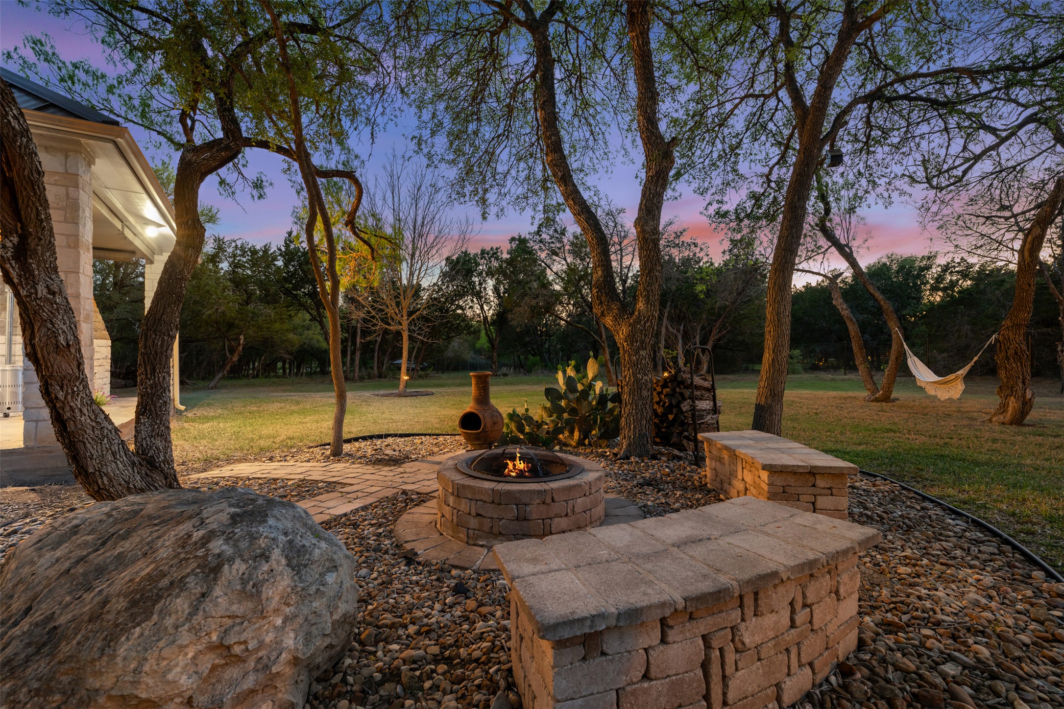 181 Whitney Run Buda, TX 78610 - Photo 4 of 40 Incredible backyard with fire pit & hill country view.