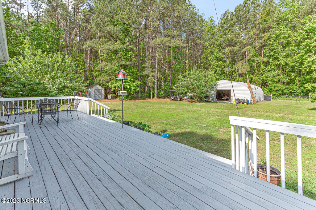 2734 Farm Life School Road Carthage, NC 28327 - Photo 30 of 47 Backyard deck off the living room