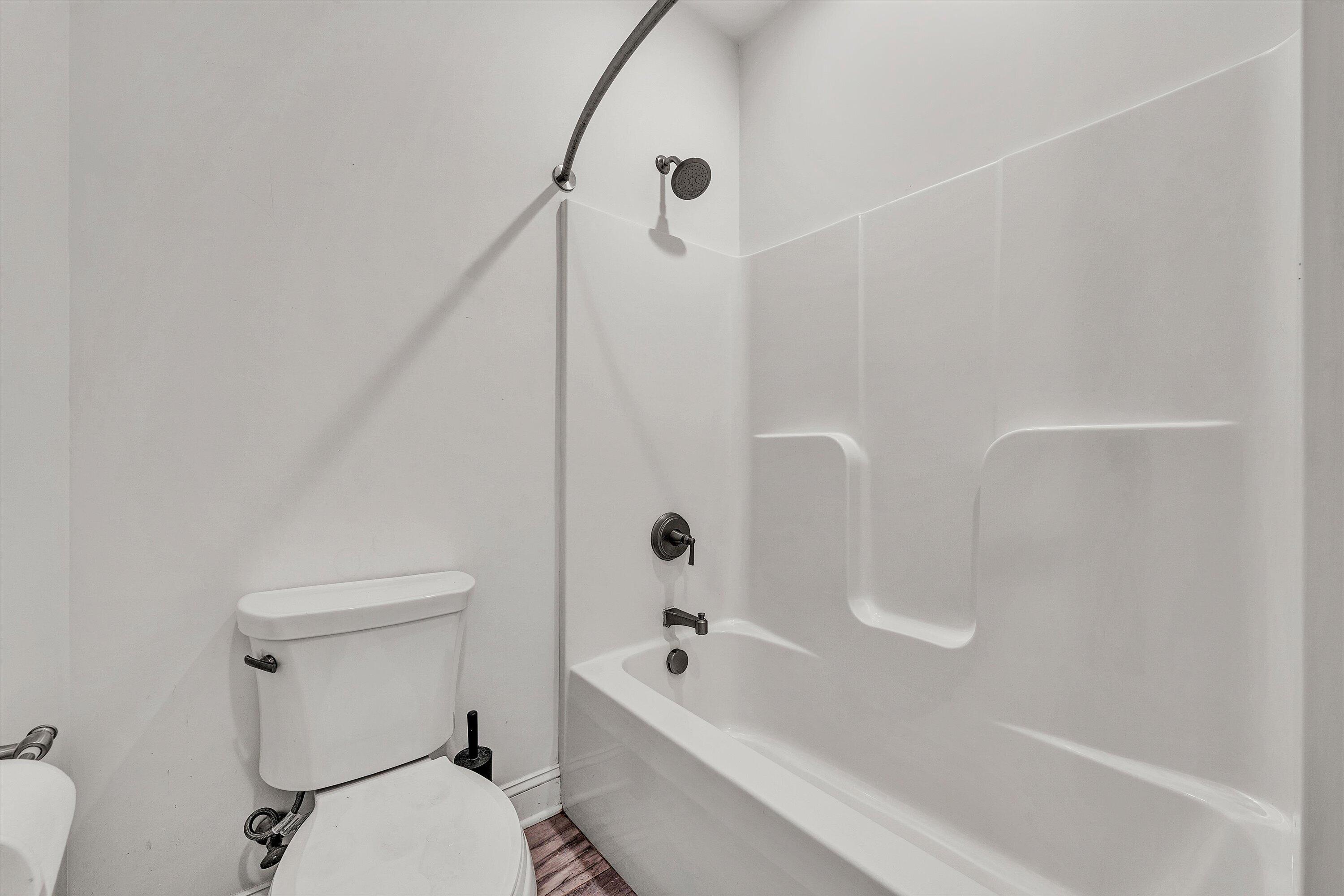 6981 Fairway Ridge Road Salem, VA 24153 - Photo 35 of 53 a bathroom with a tub a toilet and a shower