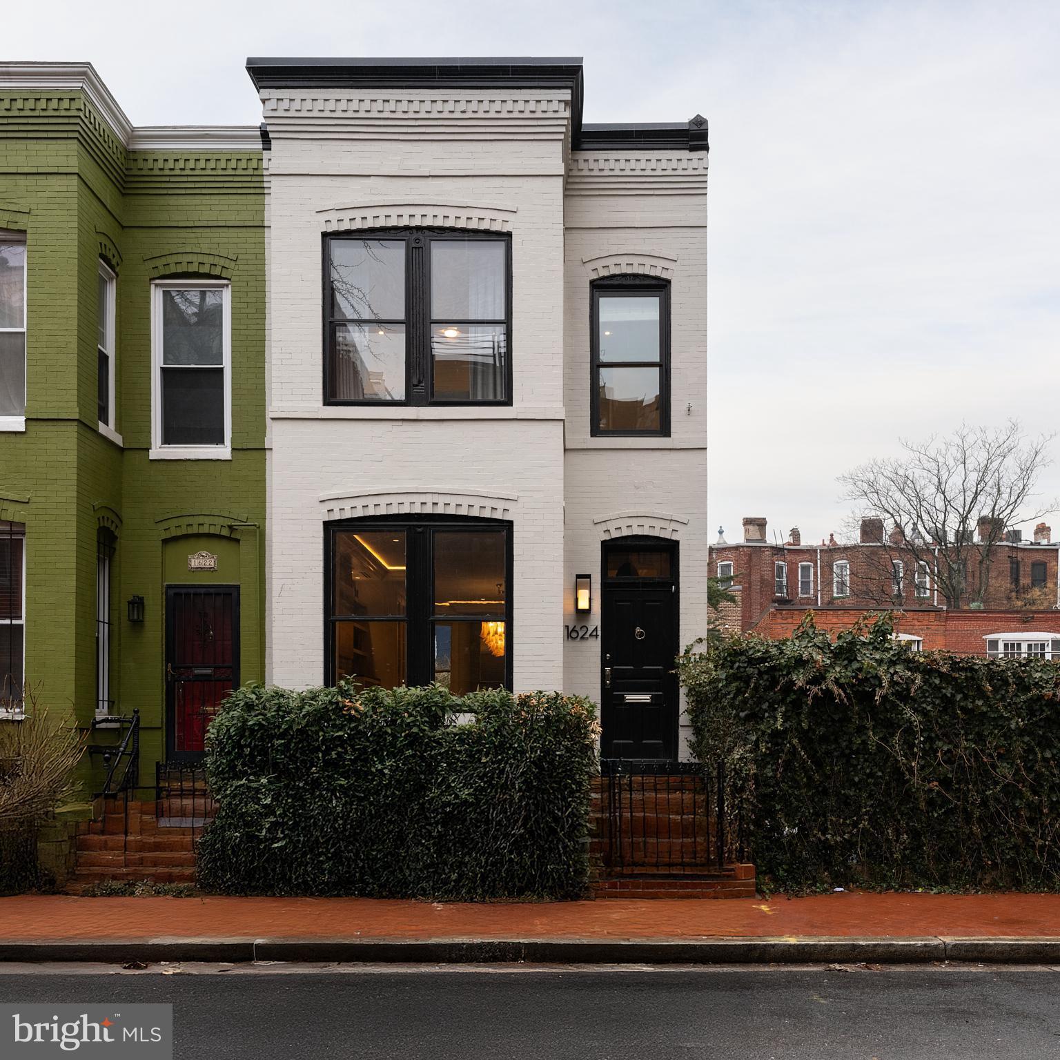 1624 Swann Street Northwest Washington, DC 20009 - Photo 1 of 16 a front view of a house with garden