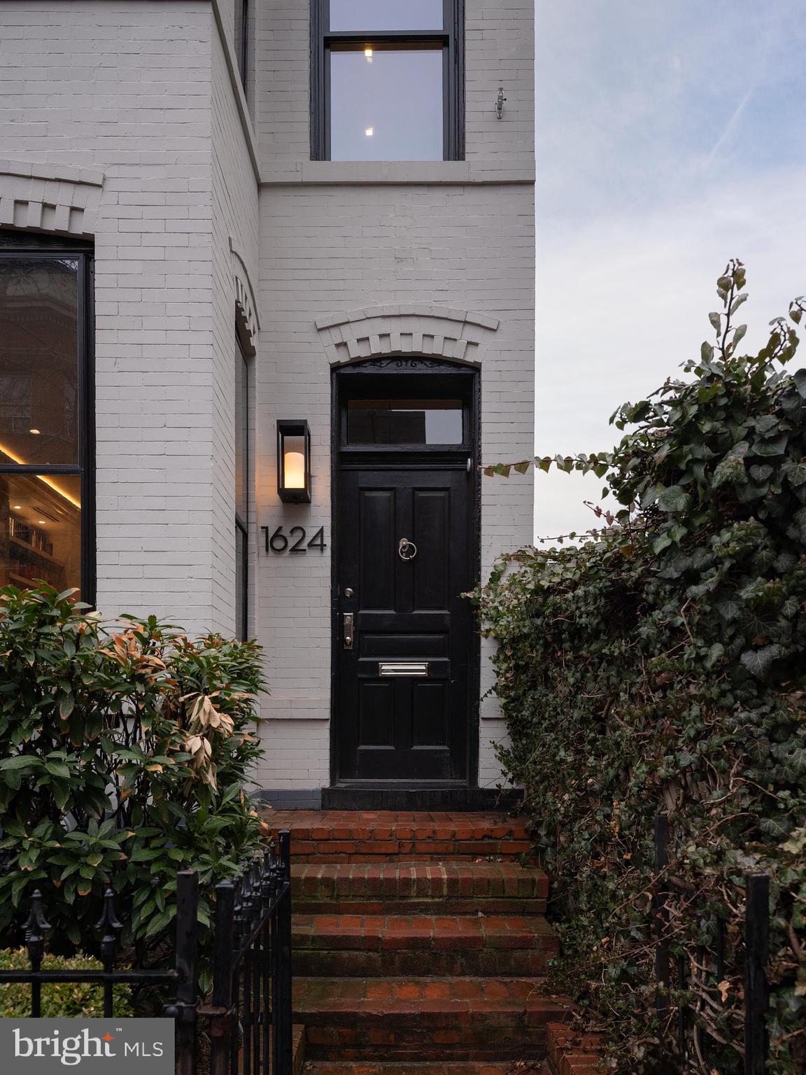 1624 Swann Street Northwest Washington, DC 20009 - Photo 2 of 16 a front view of a house with entryway