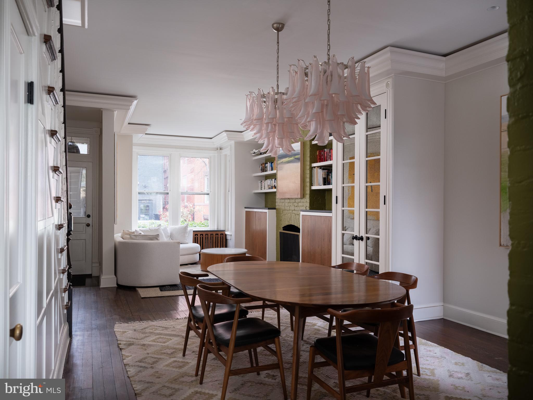 1624 Swann Street Northwest Washington, DC 20009 - Photo 7 of 16 a view of a dining room with furniture window and wooden floor