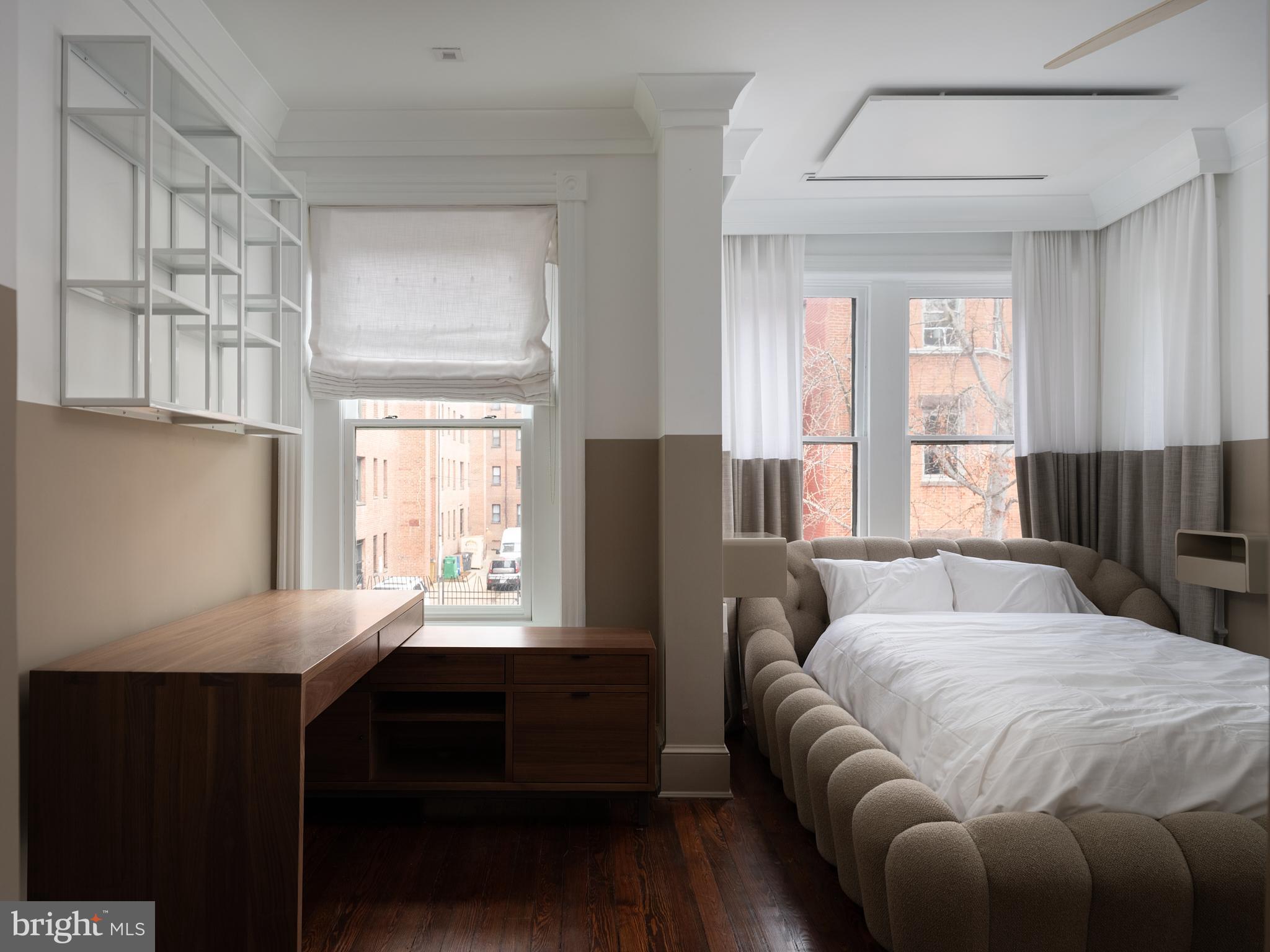 1624 Swann Street Northwest Washington, DC 20009 - Photo 10 of 16 a bedroom with a bed and a window