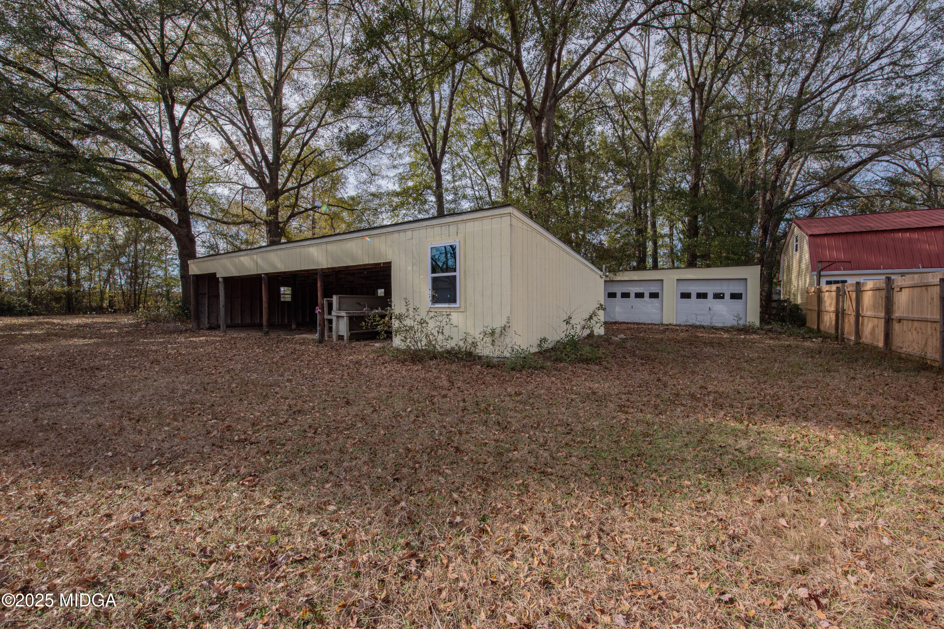 9 Friar Tuck Road Reynolds, GA 31076 - Photo 15 of 48 a view of a house with a back yard