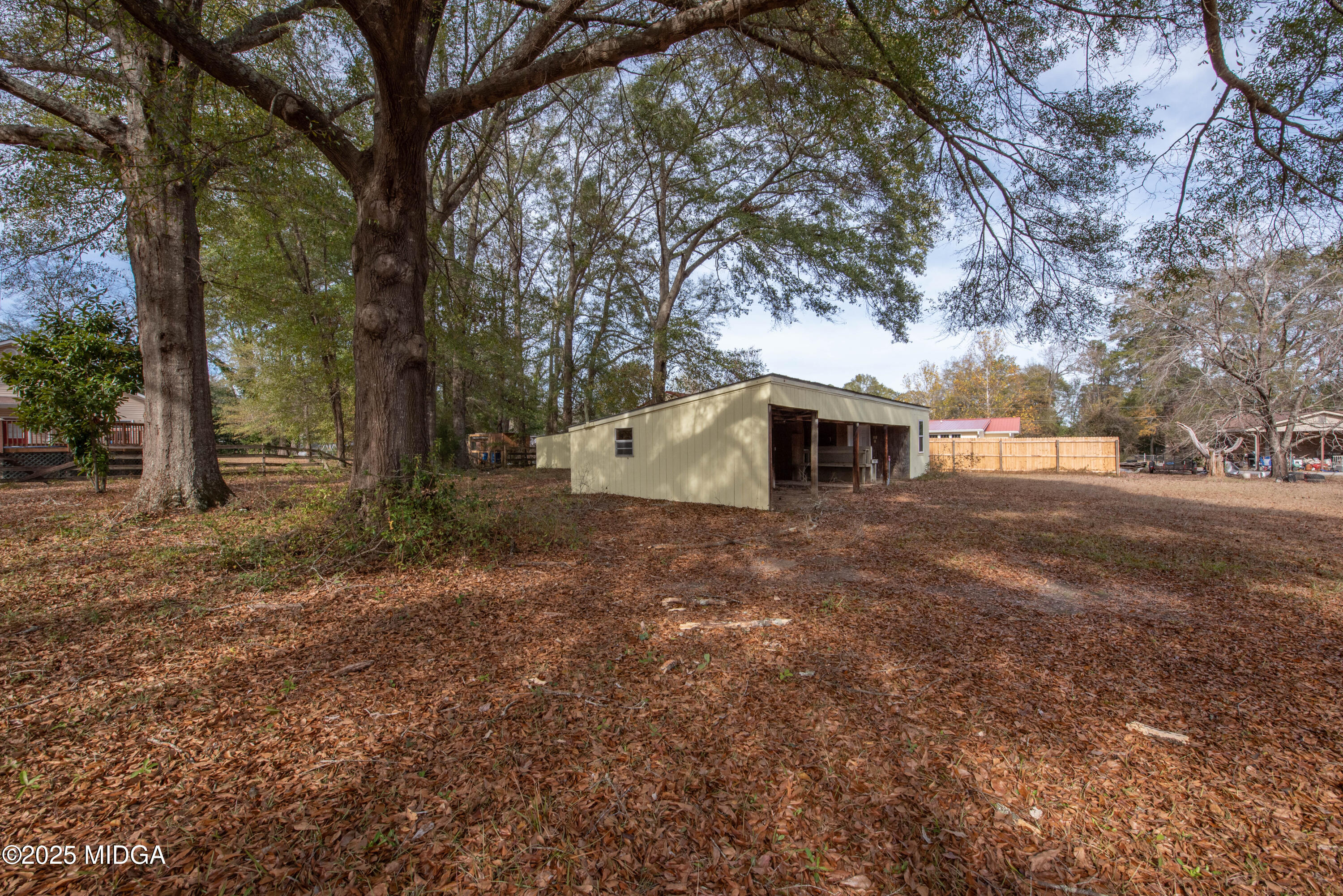9 Friar Tuck Road Reynolds, GA 31076 - Photo 16 of 48 a view of a house with a yard