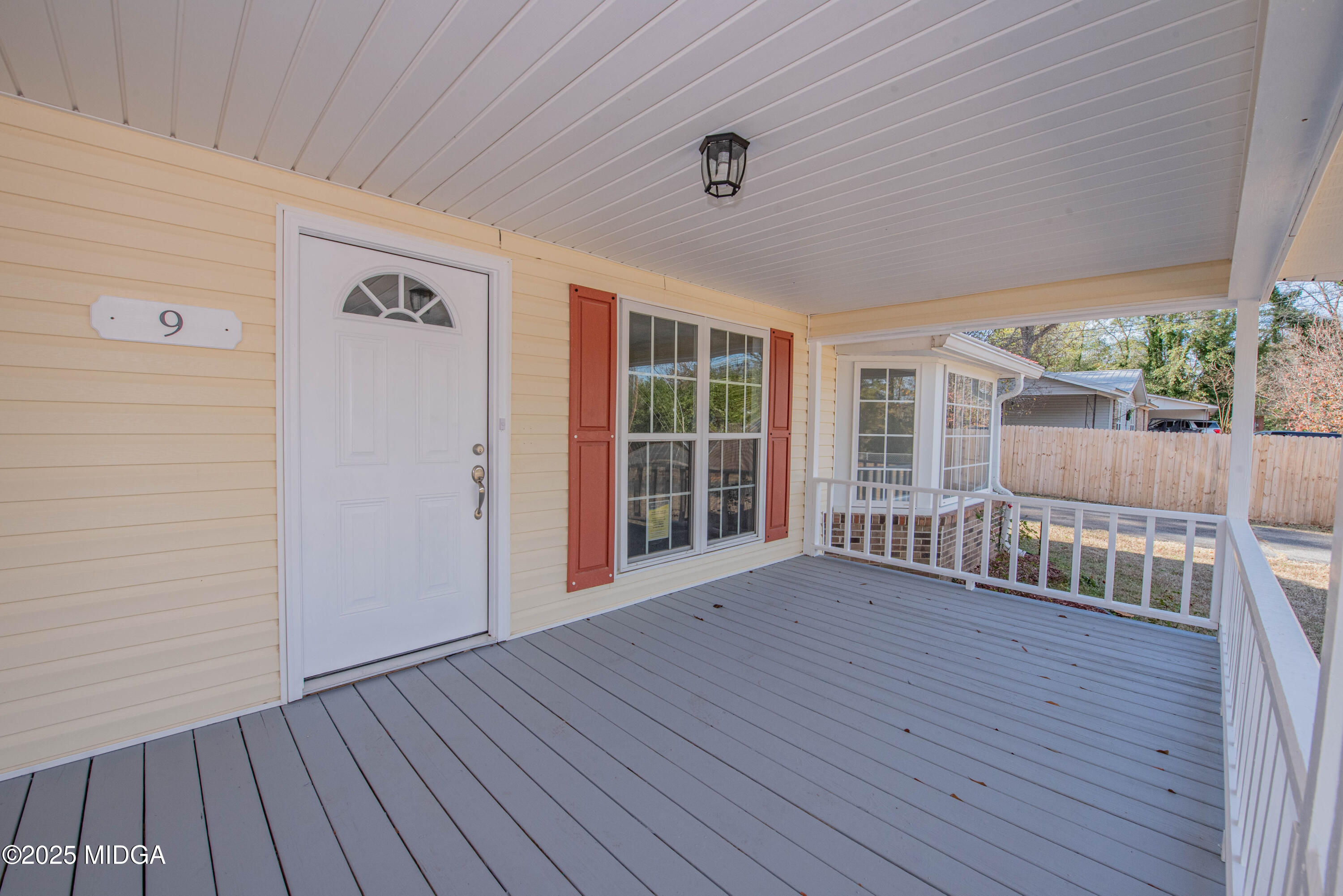 9 Friar Tuck Road Reynolds, GA 31076 - Photo 21 of 48 a view of an empty room with wooden floor and a window