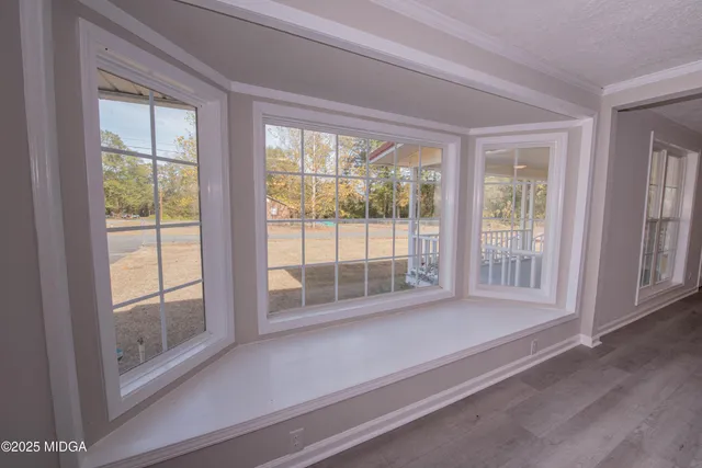 a view of a room that has a large window