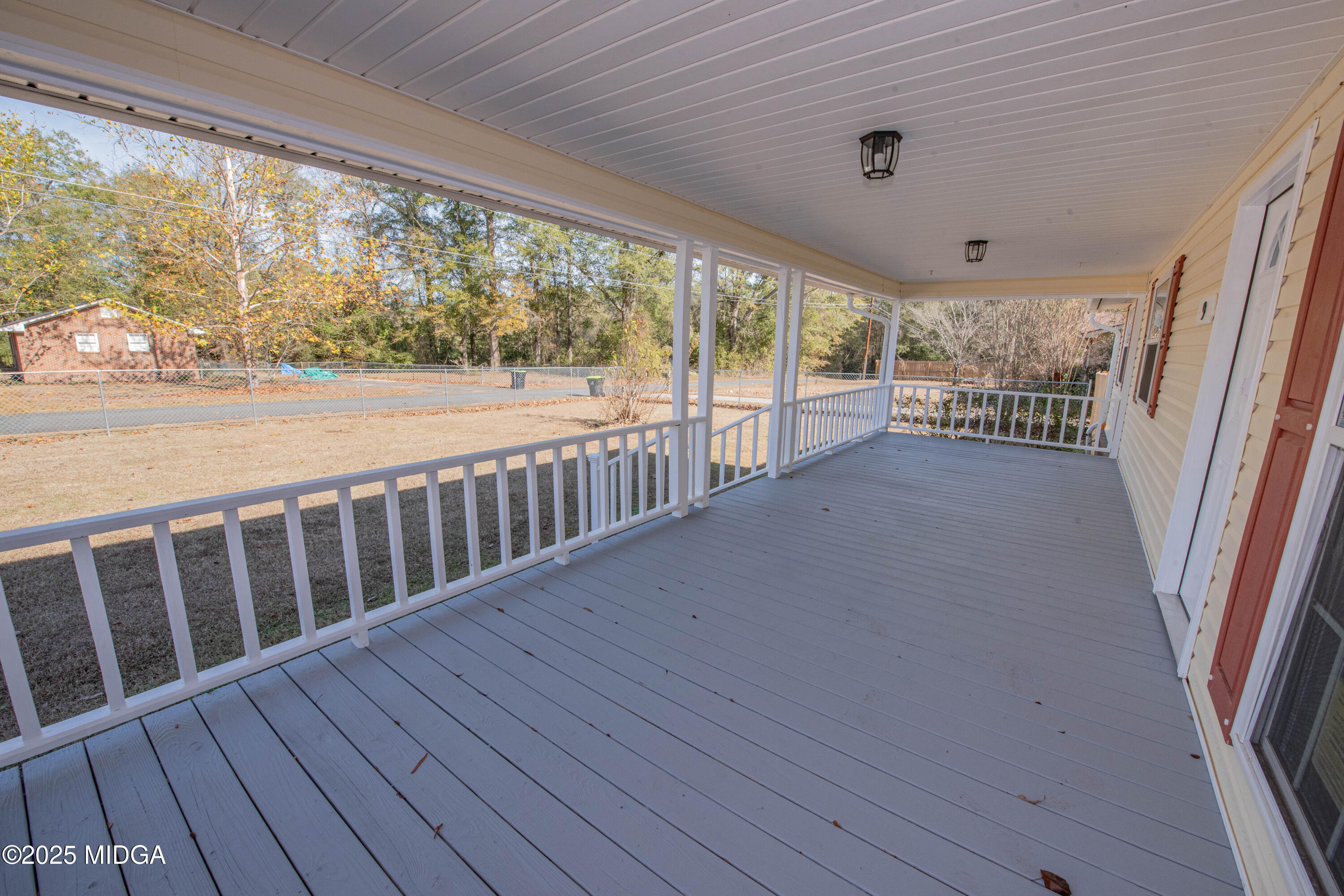 9 Friar Tuck Road Reynolds, GA 31076 - Photo 3 of 48 a view of balcony with wooden floor