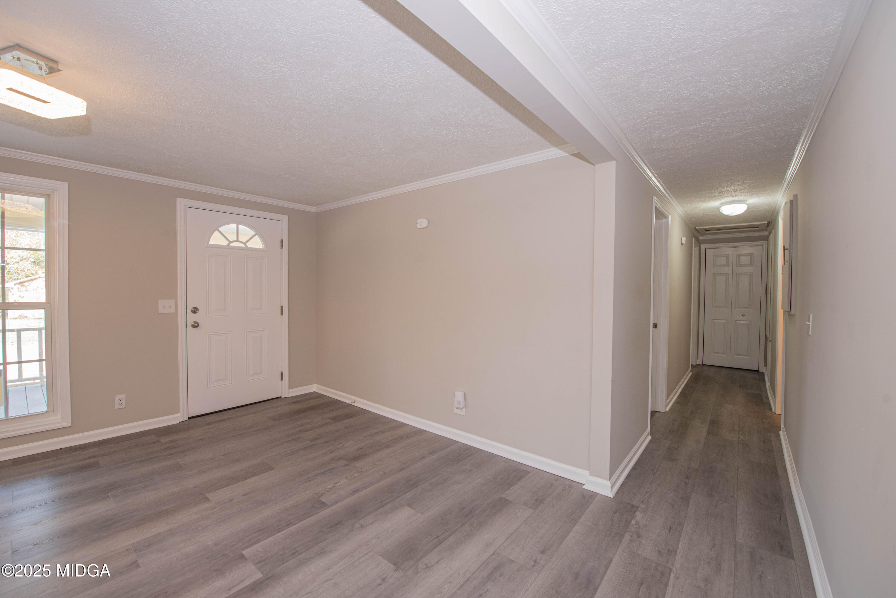 9 Friar Tuck Road Reynolds, GA 31076 - Photo 40 of 48 a view of an empty room with wooden floor and a window