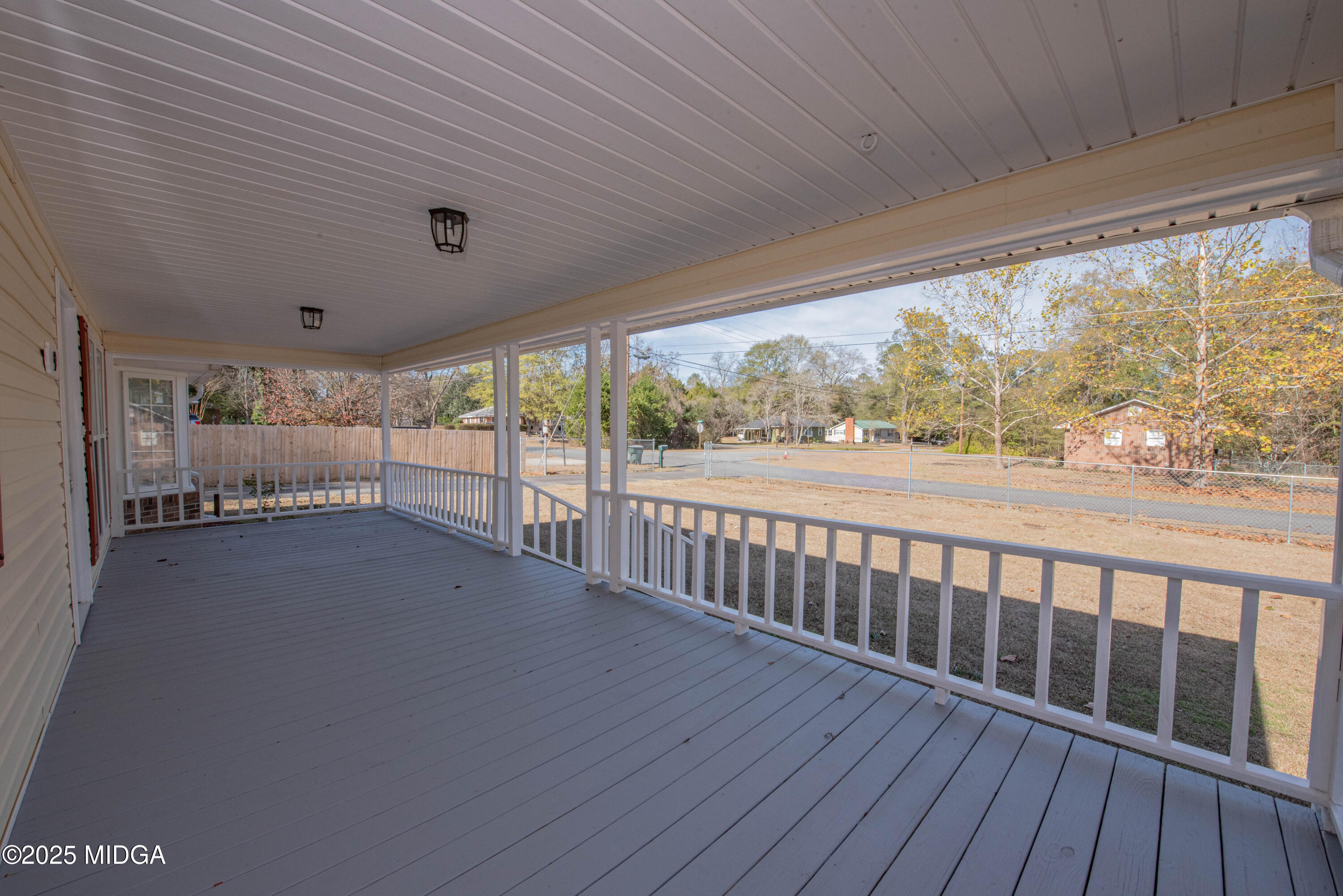 9 Friar Tuck Road Reynolds, GA 31076 - Photo 4 of 48 a view of a room with wooden floor and iron stairs