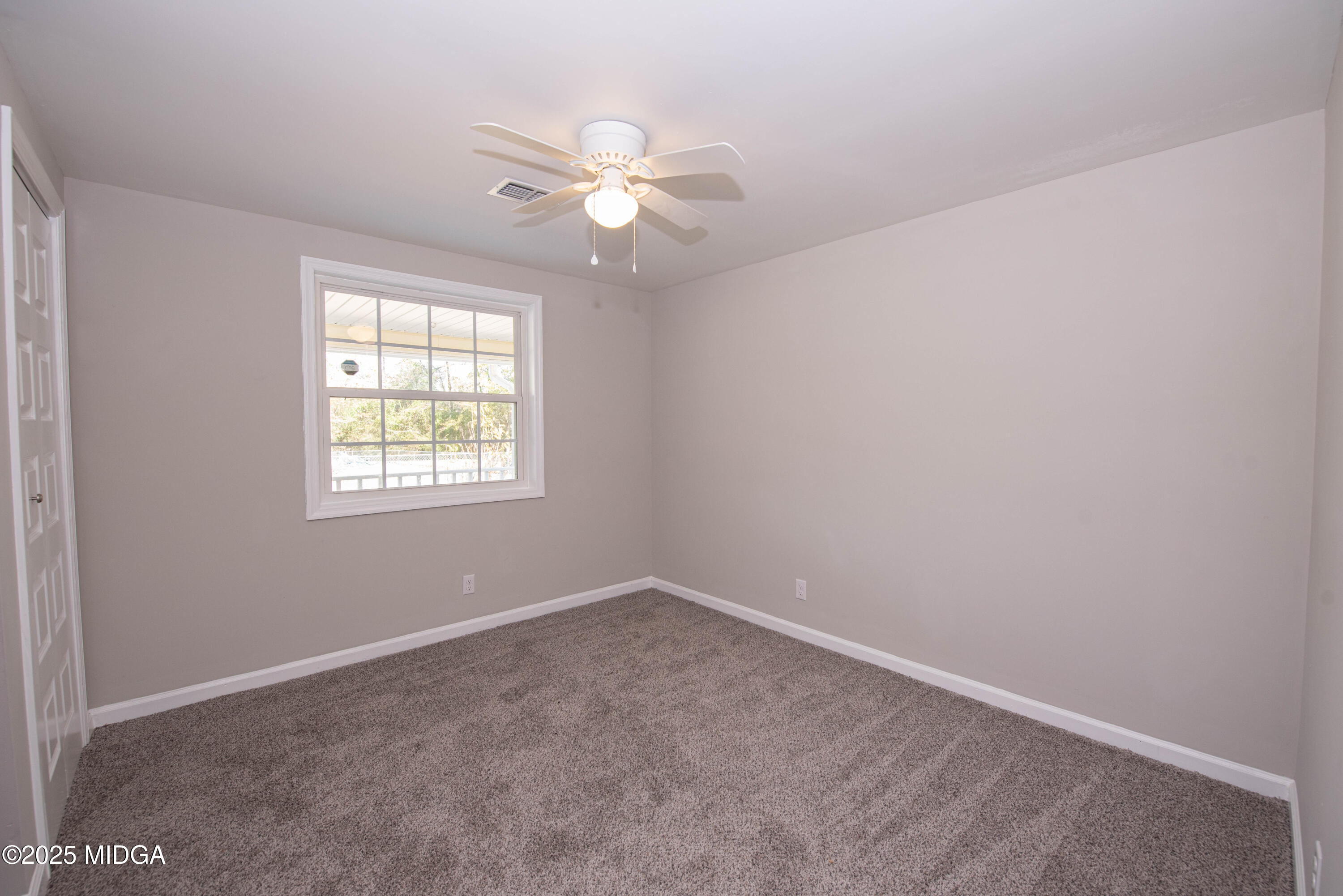 9 Friar Tuck Road Reynolds, GA 31076 - Photo 41 of 48 an empty room with windows and fan