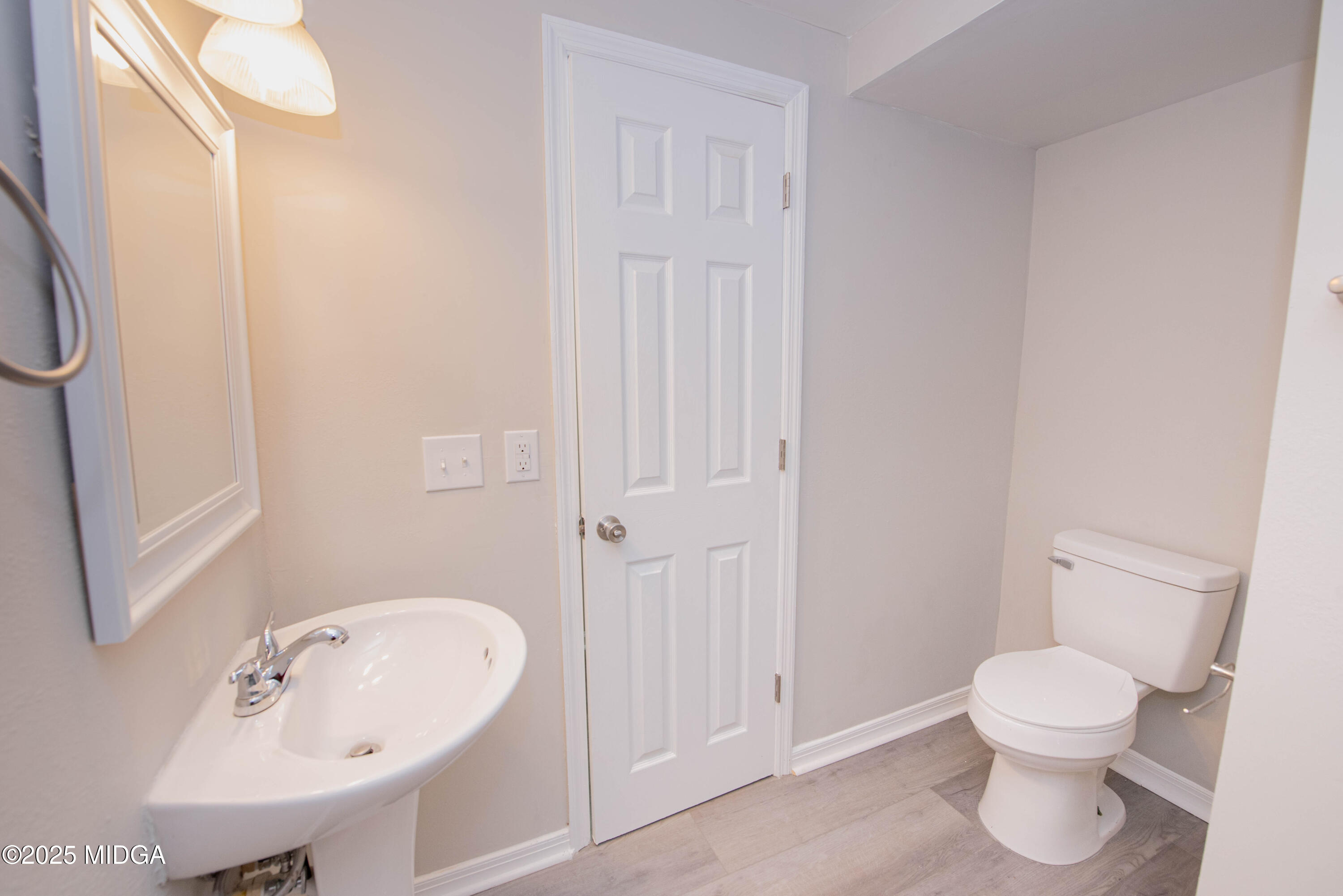 9 Friar Tuck Road Reynolds, GA 31076 - Photo 43 of 48 a bathroom with a toilet sink and a mirror