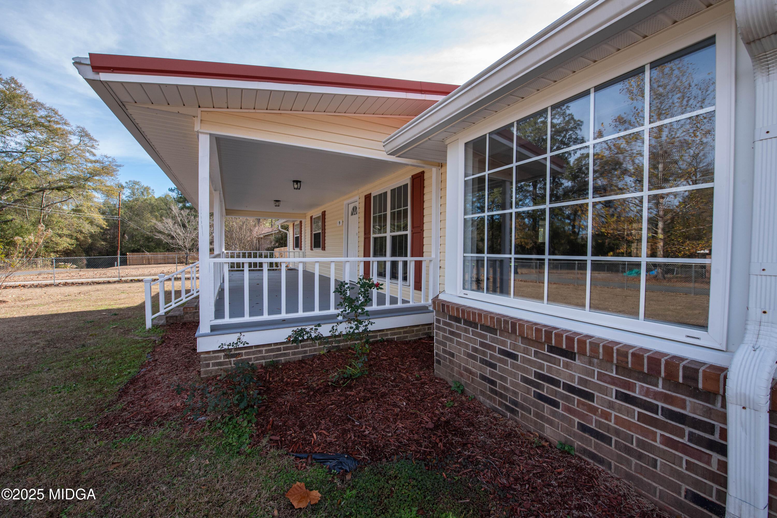 9 Friar Tuck Road Reynolds, GA 31076 - Photo 5 of 48 a view of a house with a backyard