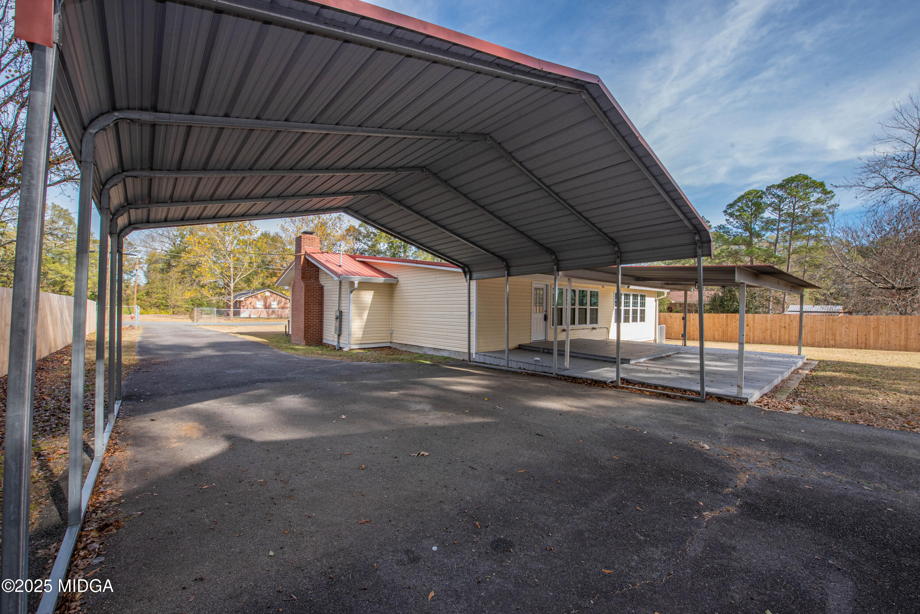 9 Friar Tuck Road Reynolds, GA 31076 - Photo 7 of 48 a view of an empty room with a garage