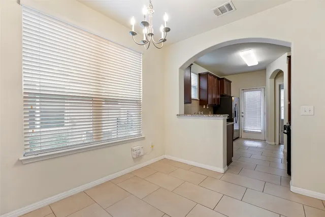 a view of a kitchen with a stove cabinets and a kitchen