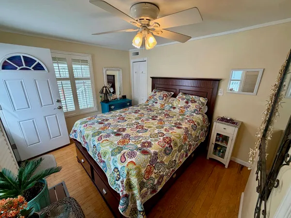 a bed sitting in a bedroom next to a window
