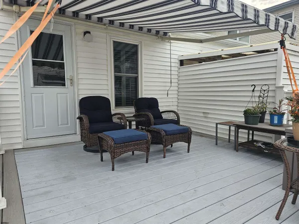 a view of a chairs and a tables in the back yard