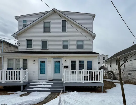 a view of a house with wooden deck