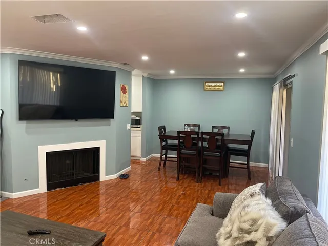 a view of a livingroom with furniture and a flat screen tv