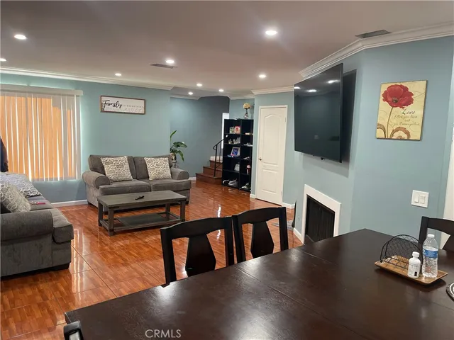 a living room with fireplace furniture and a flat screen tv
