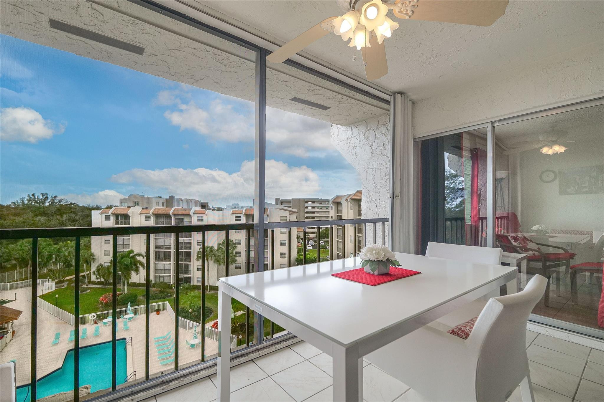 3930 Inverrary Boulevard, Unit 703D Lauderhill, FL 33319 - Photo 1 of 72 a room with pool table and large windows