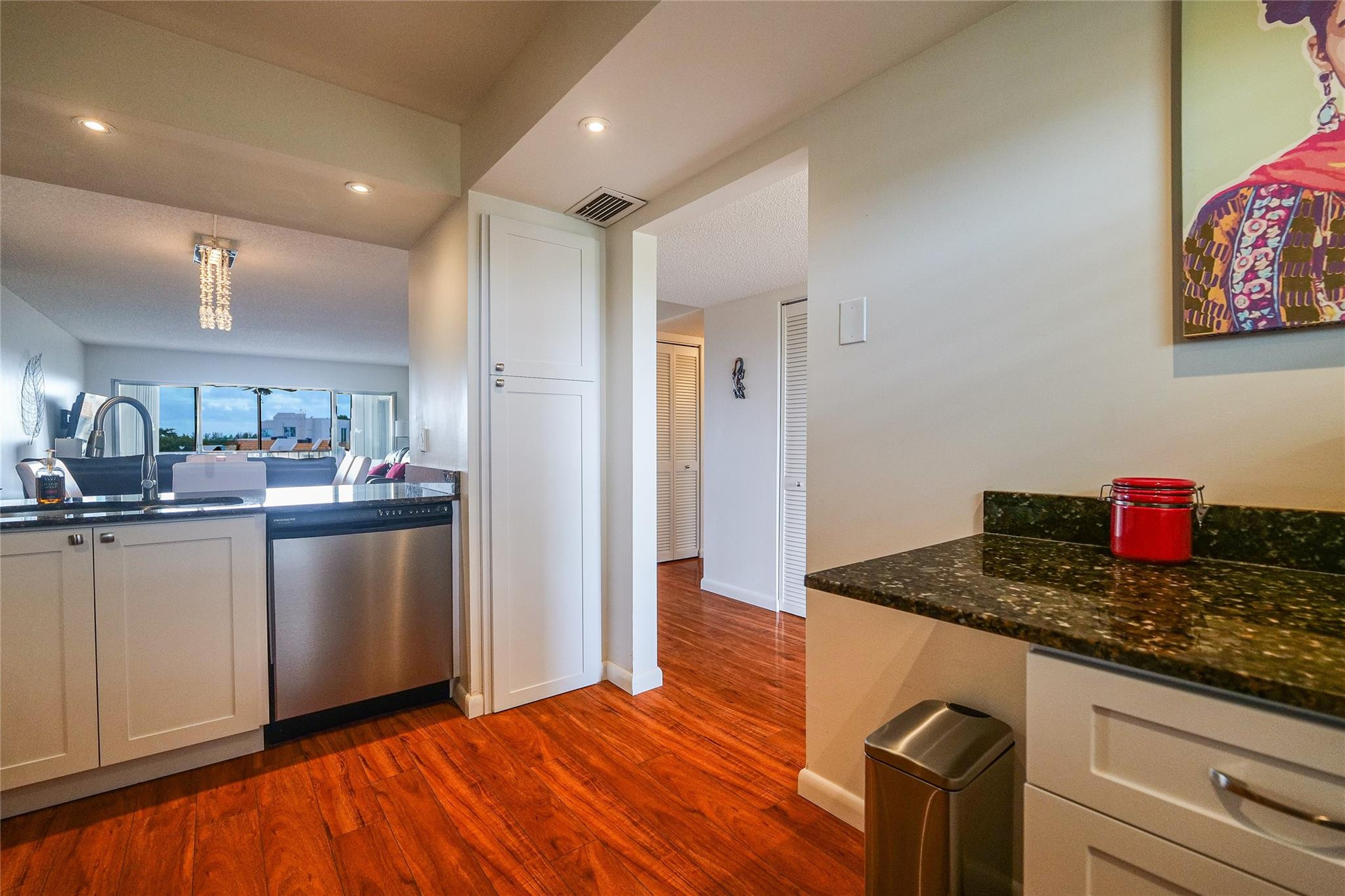 3930 Inverrary Boulevard, Unit 703D Lauderhill, FL 33319 - Photo 18 of 72 a kitchen with stainless steel appliances granite countertop a refrigerator and a sink