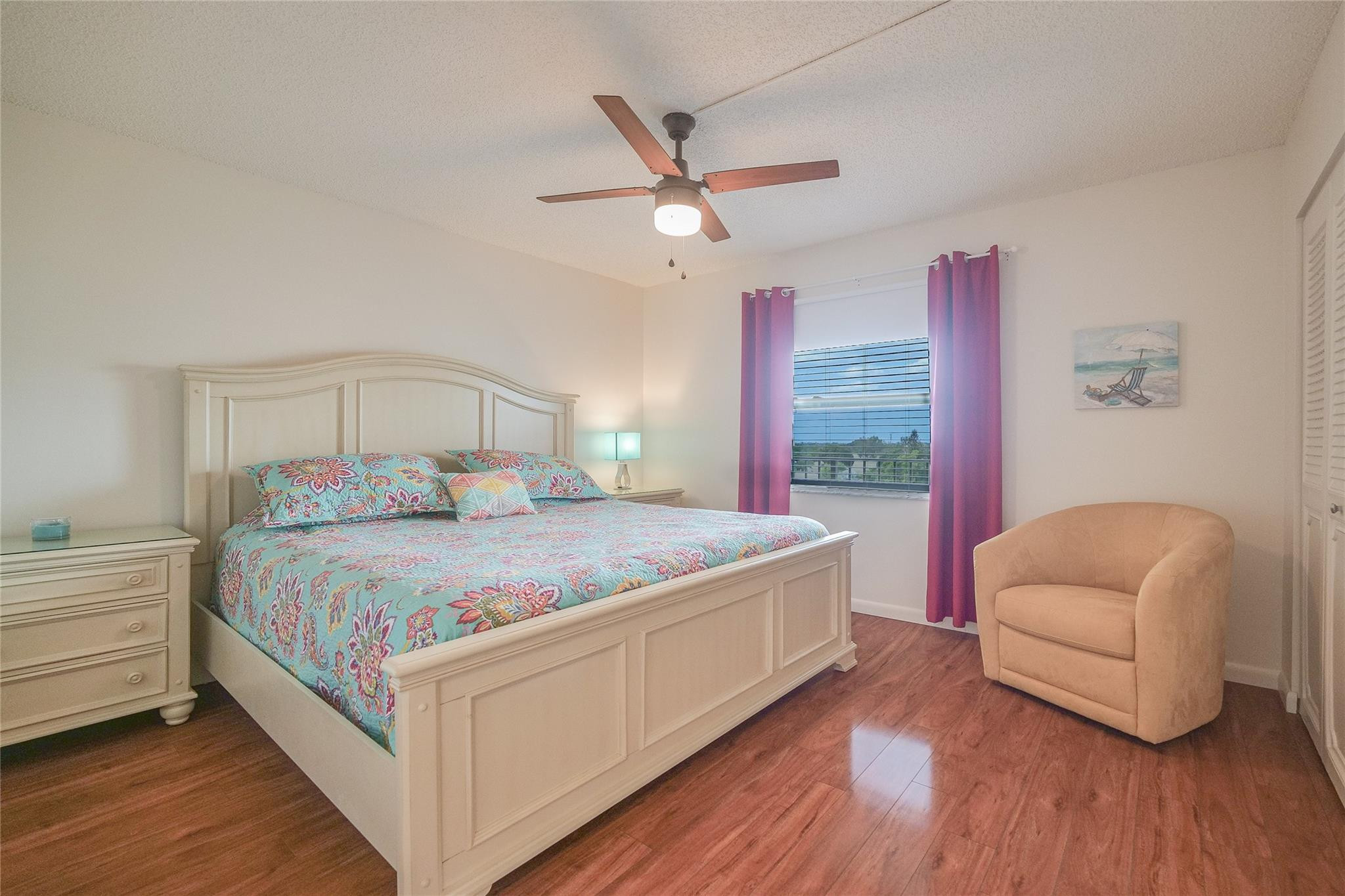 3930 Inverrary Boulevard, Unit 703D Lauderhill, FL 33319 - Photo 34 of 72 a bedroom with a bed couch and a window