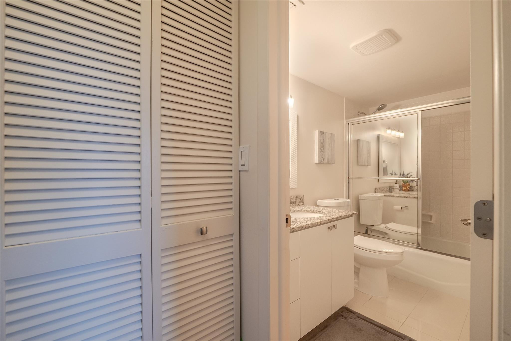 3930 Inverrary Boulevard, Unit 703D Lauderhill, FL 33319 - Photo 38 of 72 a bathroom with a sink a toilet and shower