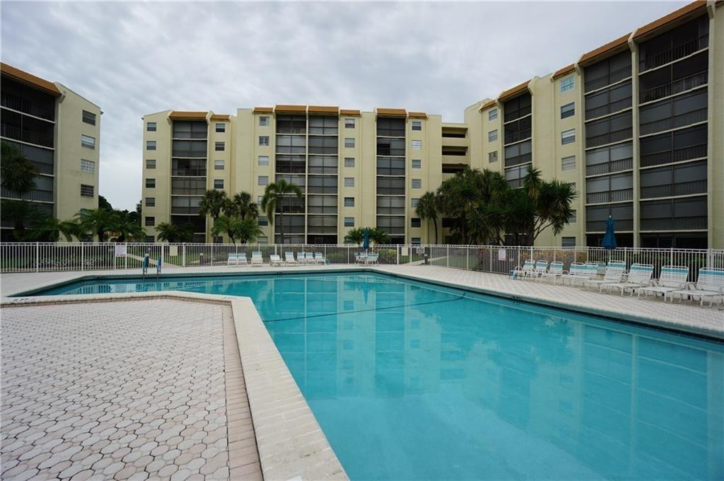 3930 Inverrary Boulevard, Unit 703D Lauderhill, FL 33319 - Photo 47 of 72 a swimming pool with outdoor seating and yard
