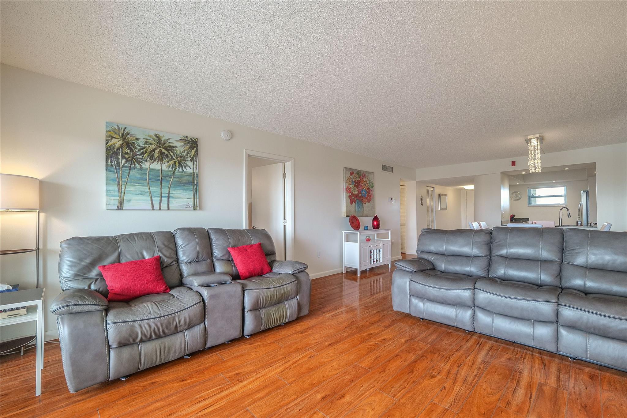 3930 Inverrary Boulevard, Unit 703D Lauderhill, FL 33319 - Photo 5 of 72 a living room with furniture and kitchen view