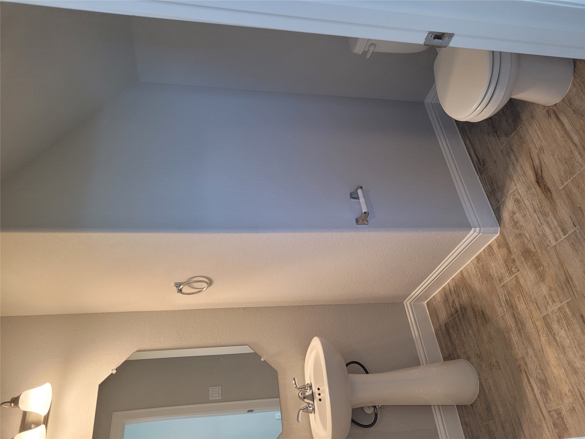 120 Free Stone Drive Georgetown, TX 78628 - Photo 5 of 40 A compact and functional bathroom featuring a pedestal sink and tile flooring.