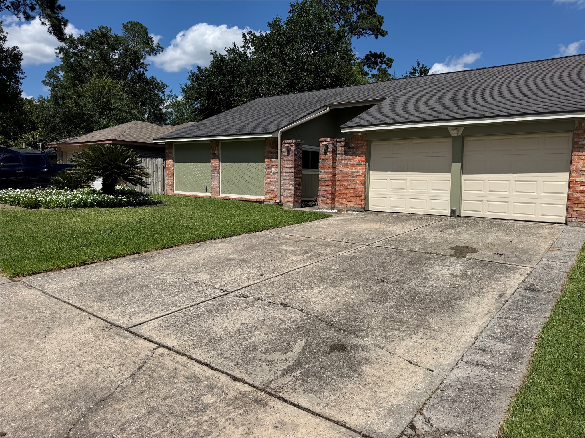 21514 Slippery Creek Lane Spring, TX 77388 - Photo 27 of 27 a front view of a house with a yard and garage