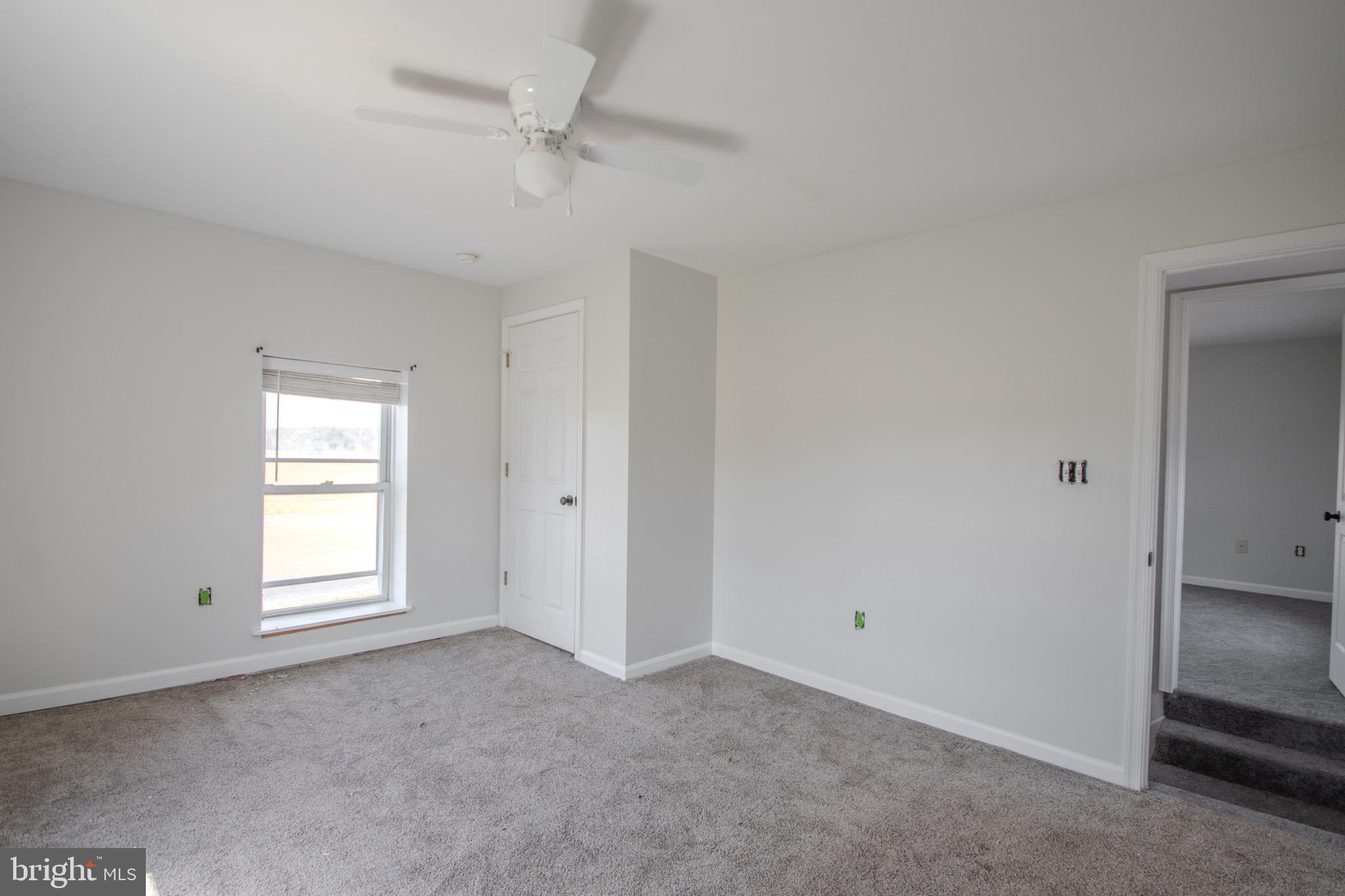 5693 Landon Store Road Marion Station, MD 21838 - Photo 14 of 20 a view of empty room with windows