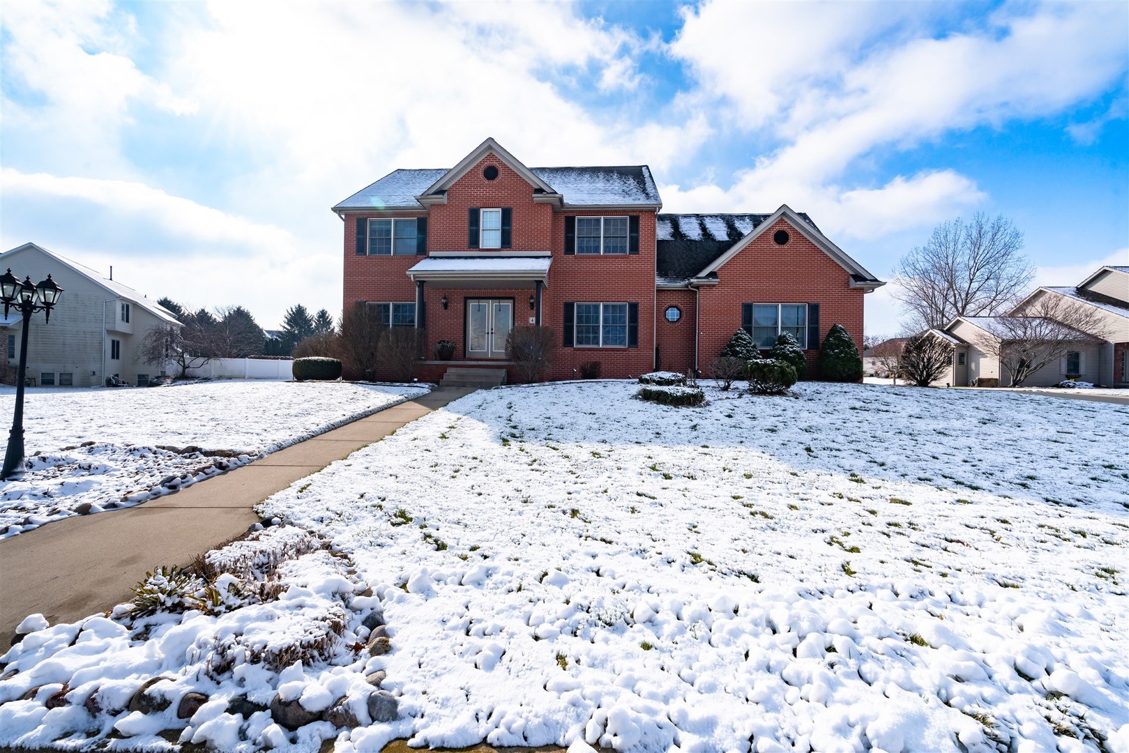 a front view of a house with a yard