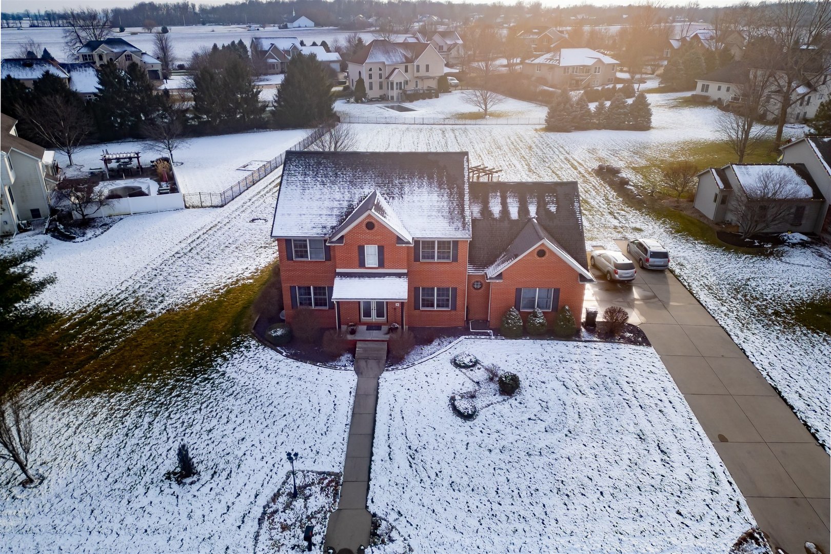 4 Cloverhill Circle Bloomington, IL 61705 - Photo 18 of 63 a view of a house with a yard covered in snow