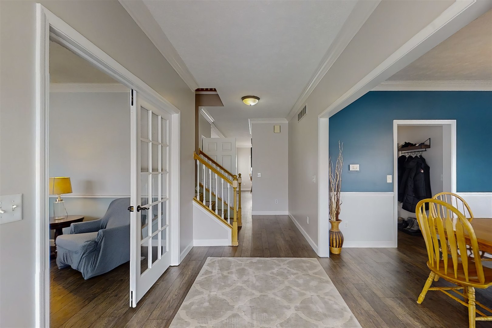 4 Cloverhill Circle Bloomington, IL 61705 - Photo 19 of 63 a view of a hallway with wooden floor and furniture