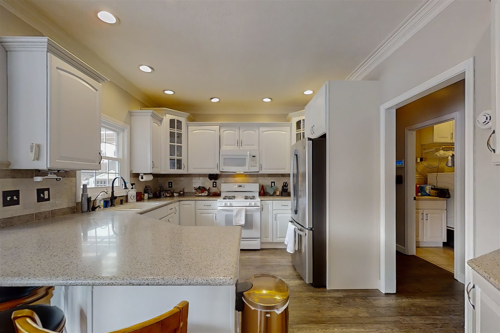 4 Cloverhill Circle Bloomington, IL 61705 - Photo 31 of 63 a kitchen with a sink and a refrigerator